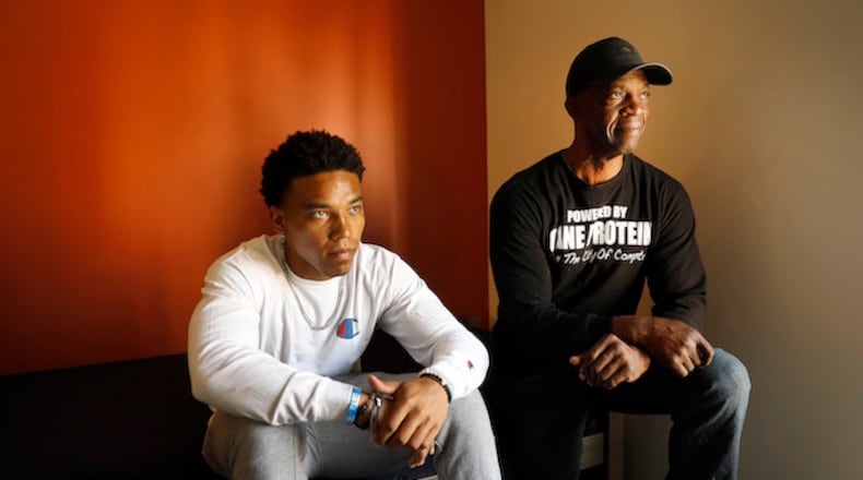 Incoming USC freshman football player Amon-Ra St. Brown, left, shares a moment with his father John Brown as his father and mother move him into his dorm for summer session on June 8, 2018. The Brown's three sons play Division I football. (Al Seib/Los Angeles Times/TNS)