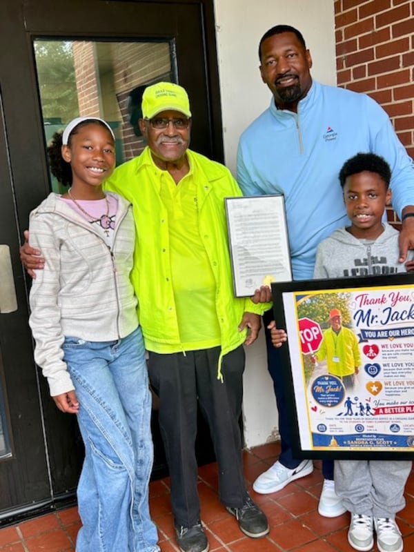 Tray Leslie (top right) poses with his grandfather, Jack Leslie, and his children, Toni and Trenton. (Courtesy of Tray Leslie)