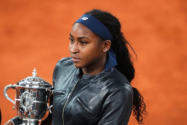 Coco Gauff of the U.S. holds the trophy while being interviewed after winning the final match of the French Tennis Open against Aryna Sabalenka of Belarus at the Roland-Garros stadium in Paris, Saturday, June 7, 2025. (AP Photo/Lindsey Wasson)