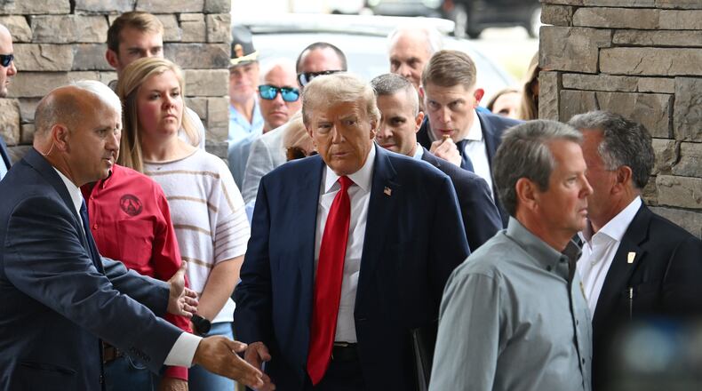 Former President Donald Trump and arrive at their Oct. 4 news conference about Hurricane Helene at the Columbia Performing Arts Center in Evans, Georgia. (Hyosub Shin/The Atlanta Journal-Constitution)