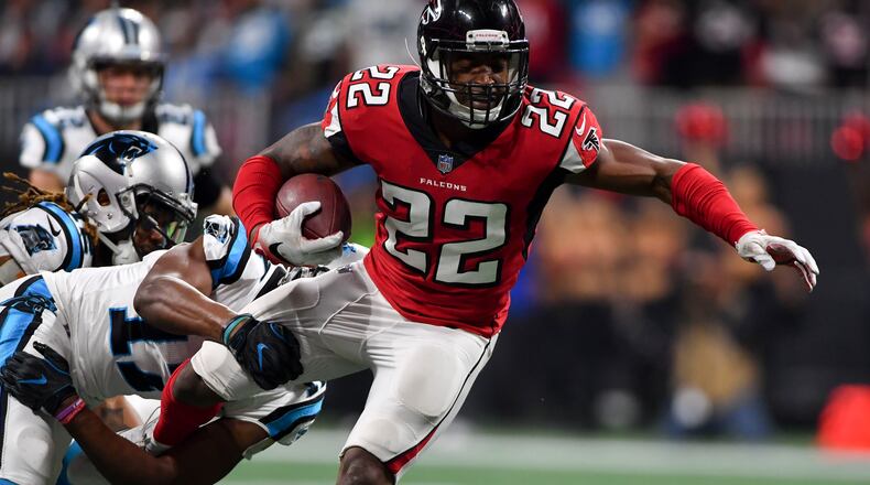 Atlanta Falcons strong safety Keanu Neal returns an interception against the Carolina Panthers late in the 4th quarter Sunday December 31, 2017. Photo by Brant Sanderlin/AJC