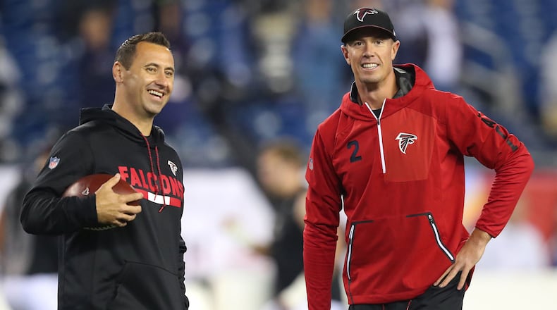 Atlanta Falcons offensive coordinator Steve Sarkisian, left, and quarterback Matt Ryan share a laugh while preparing to play the New England Patriots on October 22, 2017, at Gillette Stadium in Foxborough, Mass. (Curtis Compton/Atlanta Journal-Constitution/TNS)