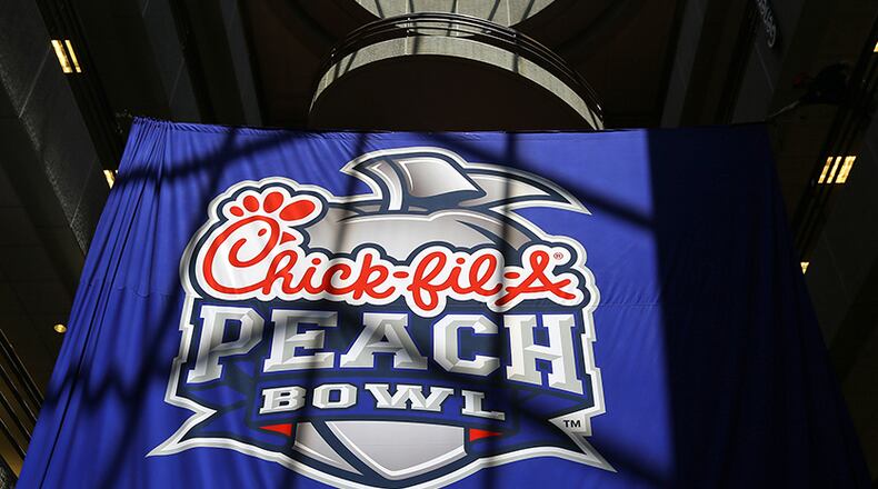 The new Chick-fil-A Peach Bowl logo is revealed at the Chick-fil-A corporate headquarters Monday, April 21, 2014, in Atlanta.