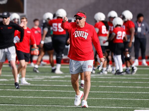 UNLV football head coach Dan Mullen instructs his players during a practice in Las Vegas, Thursday, March 27, 2025. (Bizuayehu Tesfaye/Las Vegas Review-Journal via AP)