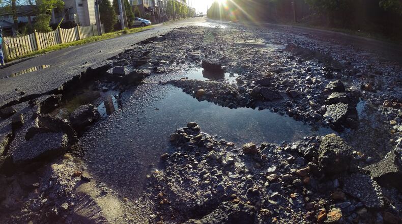 A major northeast Atlanta thoroughfare remained closed just before noon after a predawn water main break flooded the roadway.