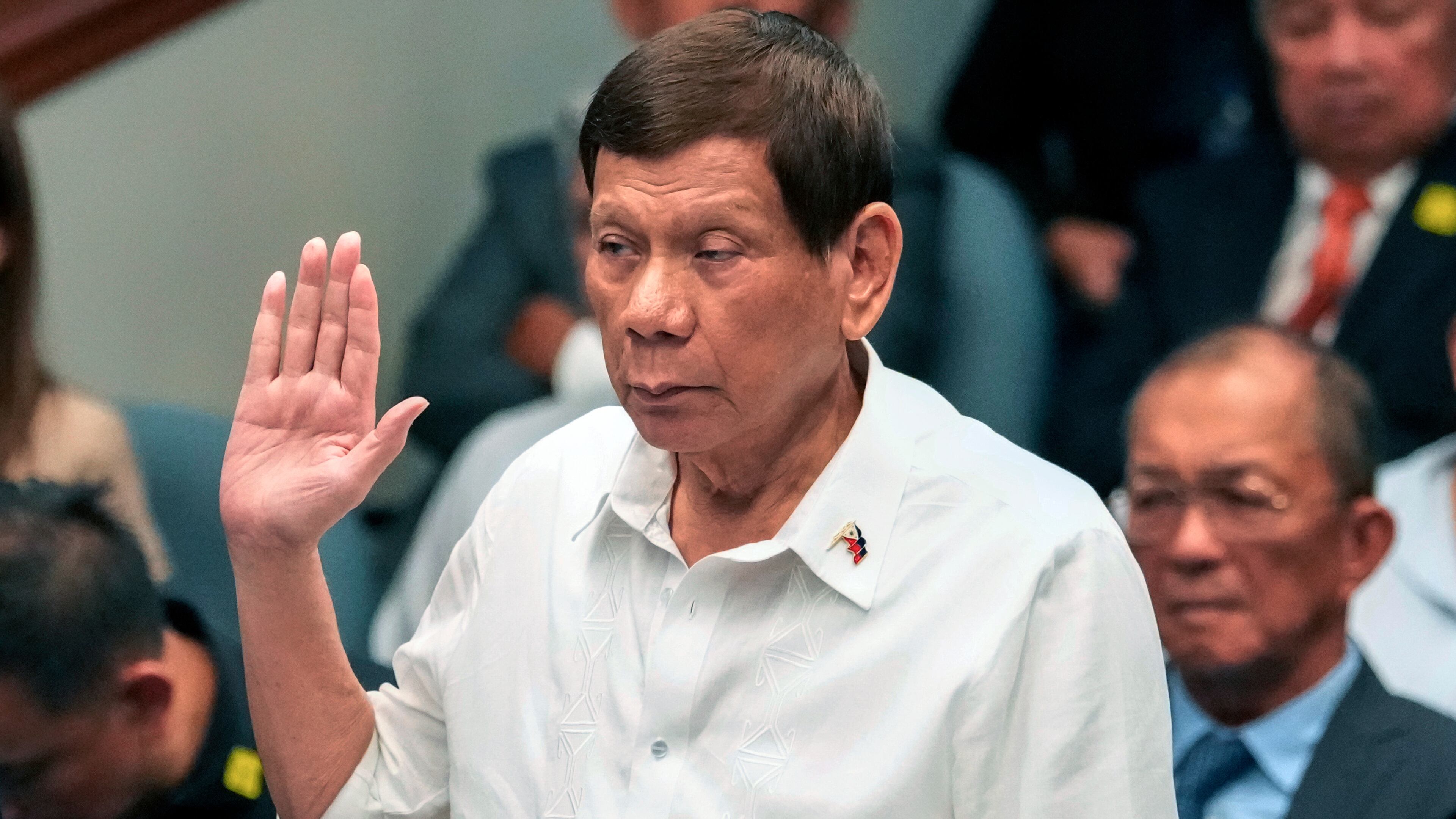 FILE - Former Philippine President Rodrigo Duterte takes oath during a senate inquiry on the so-called war on drugs during his administration at the Philippine Senate, on Oct. 28, 2024, in Manila, Philippines. (AP Photo/Aaron Favila, File)