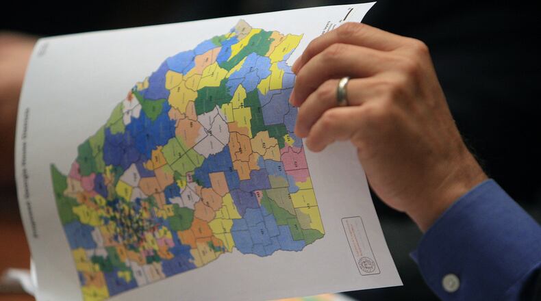 A lawmaker looks over a map of Georgia's political districts on Aug.  23, 2011.