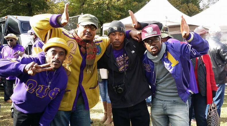 Illya E. Davis (gold sweater) enjoys Clark Atlanta University's homecoming with some college brothers. Davis is the Associate Director of the Honors Program at CAU and the campus advisor for the Beta Psi Chapter of Omega Psi Phi.