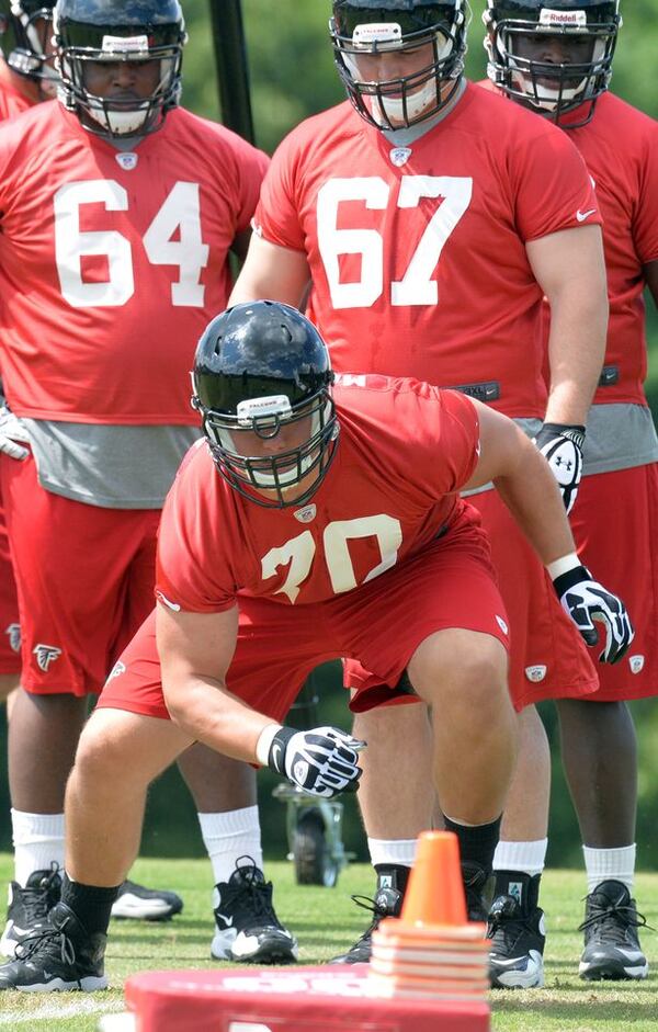 HYOSUB SHIN / AJC May 16, 2014 Flowery Branch - Atlanta Falcons rookie offensive tackle Jake Matthews #70 runs a drill during the first day of Mini-Camp for rookies on Friday, May 16, 2014. HYOSUB SHIN / HSHIN@AJC.COM