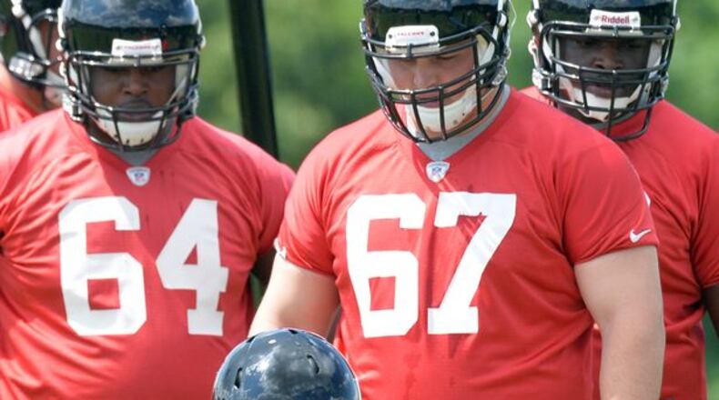 HYOSUB SHIN / AJC May 16, 2014 Flowery Branch - Atlanta Falcons rookie offensive tackle Jake Matthews #70 runs a drill during the first day of Mini-Camp for rookies on Friday, May 16, 2014. HYOSUB SHIN / HSHIN@AJC.COM