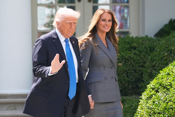 President Donald Trump and first lady Melania Trump arrive in the Rose Garden at the White House, Monday, May 19, 2025 in Washington, where President Trump will sign the "Take It Down Act". (AP Photo/Manuel Balce Ceneta)