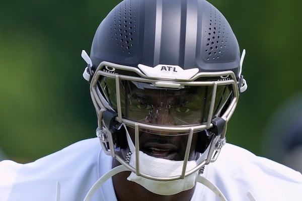 Atlanta Falcons edge rusher James Pearce Jr.,(27) runs drills during the NFL football team's rookie minicamp, Friday, May 9, 2025, in Flowery Branch, Ga. (AP Photo/Brynn Anderson)