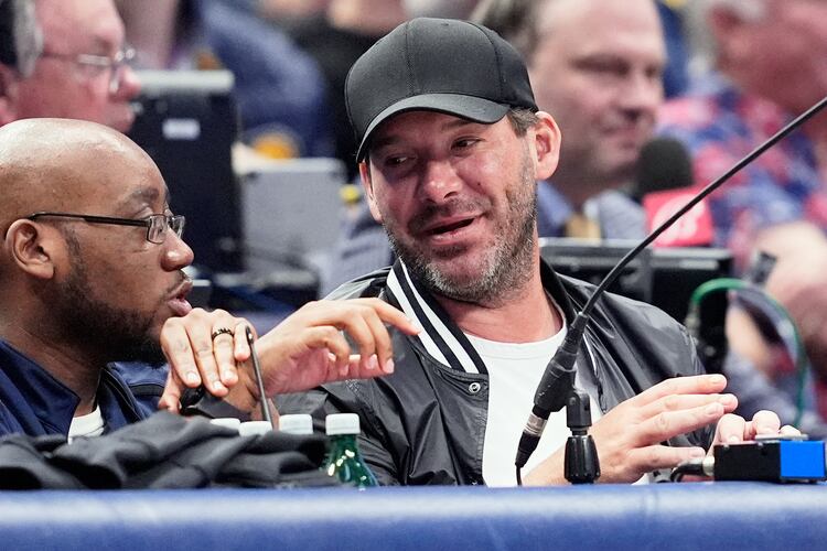 FILE - Former NFL quarterback Tony Romo, right, attends an NBA basketball game between the Indiana Pacers and the Dallas Mavericks on March 5, 2024, in Dallas. (AP Photo/Tony Gutierrez, File)