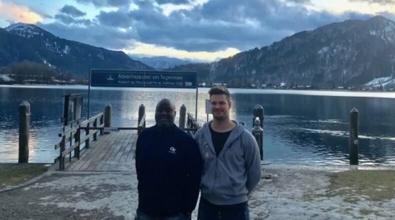 Georgia Tech defensive line coach Mike Pelton poses with defensive end prospect Julius Welschof in front of Tegernsee, a lake near Welschof's hometown of Miesbach, Germany.