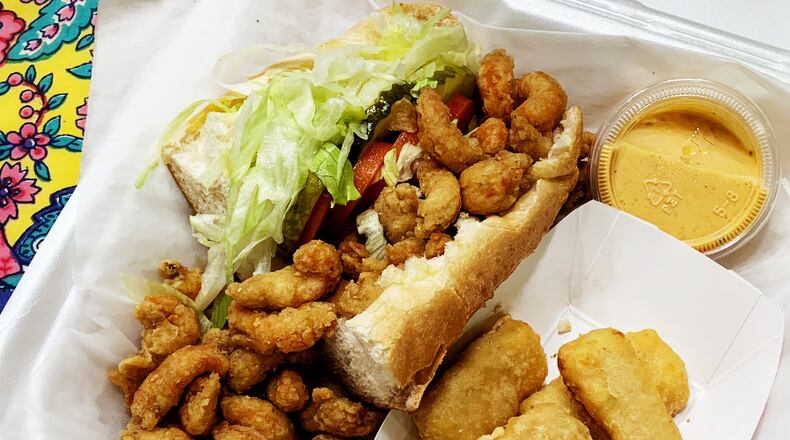 The crawfish po'boy from Crawfish Shack features crawfish chunks that are plump and juicy, with a well-balanced meat-to-breading ratio. Henri Hollis for The Atlanta Journal-Constitution.