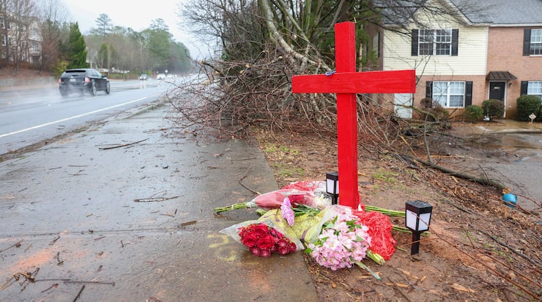 A memorial for University of Georgia football player Devin Willock and UGA football staff member Chandler LeCroy at the site where their automobile crashed on Barnet Shoals Road on Jan. 19, 2023, in Athens, Georgia. Willock and LeCroy died from their injures. (Jason Getz/The Atlanta Journal-Constitution/TNS)