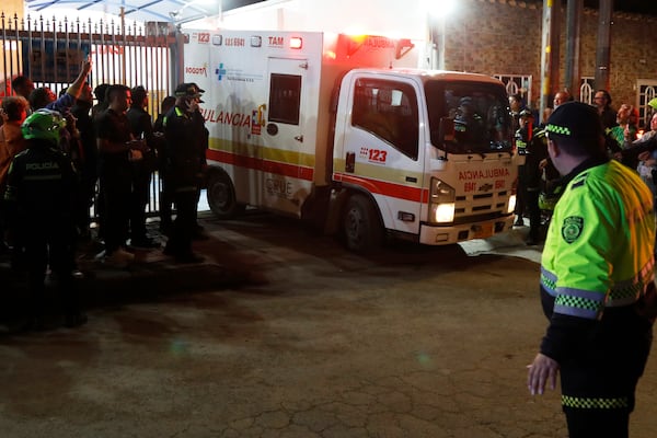 An ambulance leaves the Medicentro hospital carrying Colombian senator and presidential candidate Miguel Uribe Turbay to another hospital for treatment after he was shot during a campaign rally in Bogota, Colombia, Saturday, June 7, 2025. (AP Photo/Jhon Wilson Vizcaino)