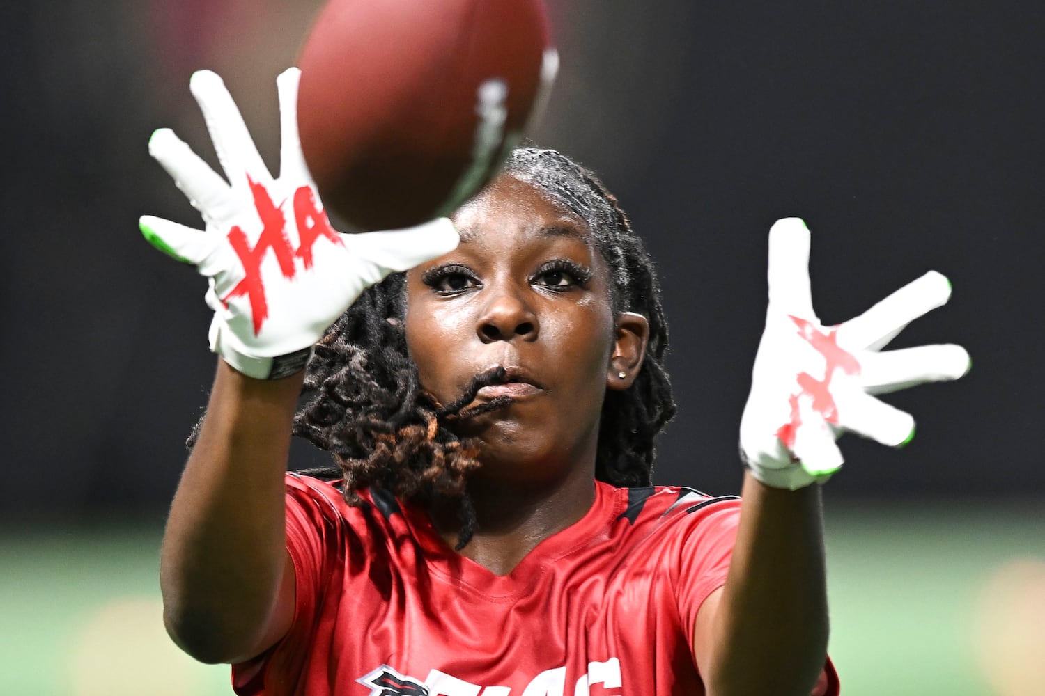 Paige Ingram reaches out to catch a pass during the 5th annual Girls Flag Football Showcase. (Daniel Varnado for the AJC)