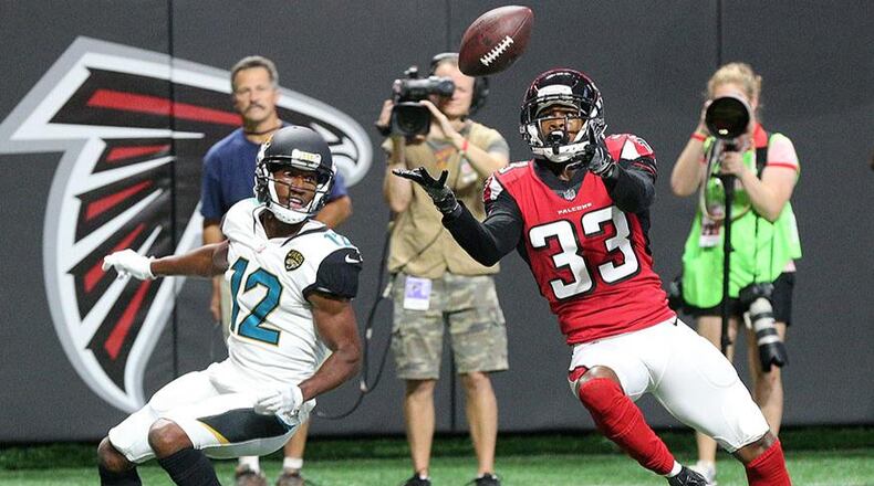 Falcons cornerback Blidi Wreh-Wilson intercepts the ball in front of Jaguars wide receiver Dede Westbrook in the end zone during the first quarter in a NFL preseason football game on Thursday, Aug. 31, 2017, in Atlanta.