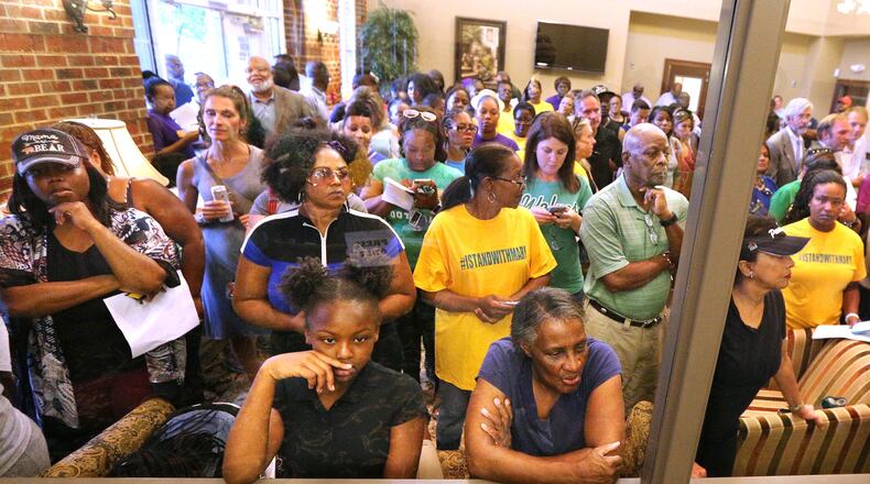 An overflow crowd attended the first Buford Board of Education meeting after an audio recording surfaced of a person using racial slurs to refer to black temporary construction workers and threatening them. The speaker on the tape was said to be Superintendent Geye Hamby, who soon resigned. CURTIS COMPTON/CCOMPTON@AJC.COM