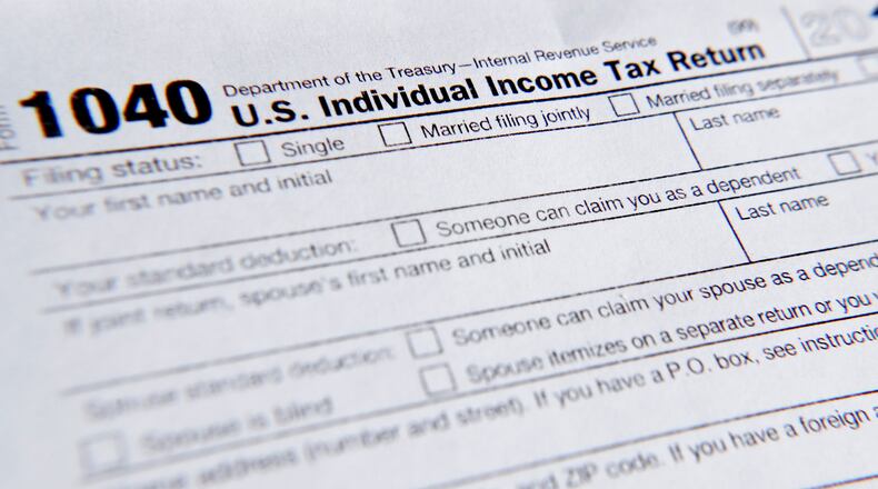 FILE - A 1040 tax form printed from the Internal Revenue Service web page is seen, Feb. 13, 2019, in Zelienople, Pa. (AP Photo/Keith Srakocic, File)