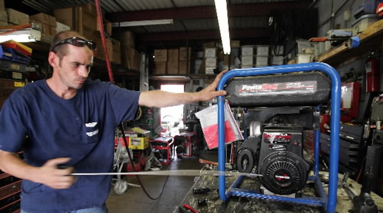 Mechanic Carlos Fernandez tests a generator that was brought in for repair at Blast Off Equipment in West Palm Beach.