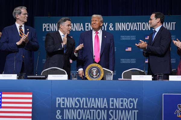 President Donald Trump arrives to speak at the "Inaugural Pennsylvania Energy and Innovation Event" at Carnegie Mellon University, Tuesday, July 15, 2025, in Pittsburgh. Standing with the President are from left, Treasury Secretary Scott Bessent, Sen. Dave McCormick, R-Pa., Trump and Jon Gray, President and Chief Operating Officer, Blackstone. (AP Photo/Evan Vucci)