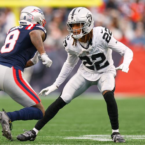 FILE - Las Vegas Raiders cornerback Eric Stokes (22) covers New England Patriots wide receiver Stefon Diggs (8) during the second half of an NFL football game Sept. 7, 2025, in Foxborough, Mass. (AP Photo/Greg M. Cooper, File)
