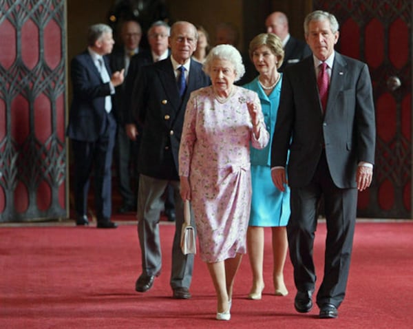 Queen Elizabeth and President Bush walk ahead of the Duke of Edinburgh and Laura Bush in St George's Hall, Windsor Castle on Sunday. Bush is in England for talks with British leaders. (Dominic Liplinski, Pool/AP)
