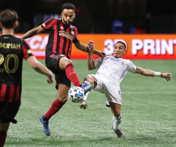 Atlanta United defender Anton Walkes (left) just beats FC Cincinnati midfielder Adrien Regattin to the ball during a 2-1 Atlanta United victory Saturday, March 8, 2020, in Atlanta.   Curtis Compton ccompton@ajc.com