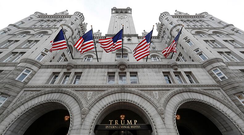 In this photo taken Dec. 21, 2016, the Trump International Hotel in Washington. Trump's $200 million hotel inside the federally owned Old Post Office building has become the place to see, be seen, drink, network, even live, for the still-emerging Trump set. It's a rich environment for lobbyists and anyone hoping to rub elbows with Trump-related politicos, despite the veil of ethics questions that hangs overhead.