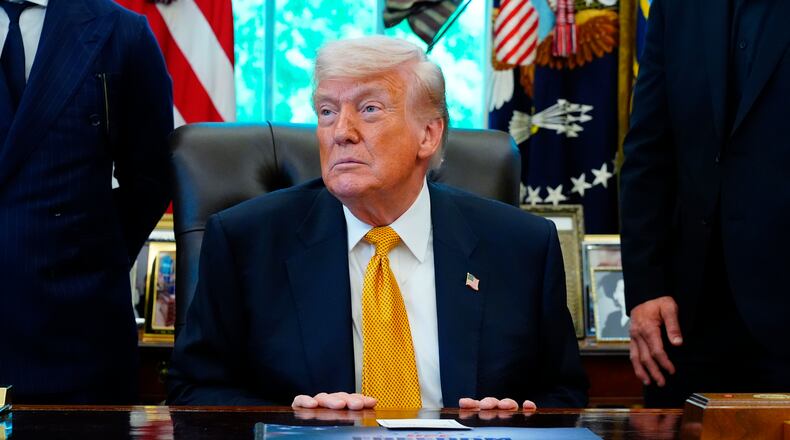 President Donald Trump meets with UFC fighters, Wednesday, May 6, 2026, in the Oval Office of the White House, in Washington. (AP Photo/Jacquelyn Martin)