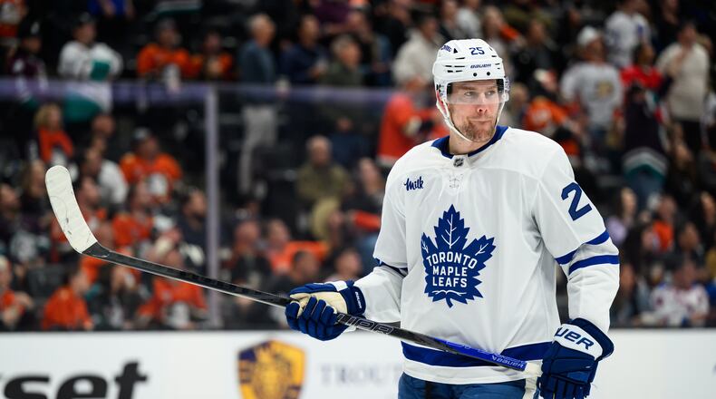 FILE - Toronto Maple Leafs defenseman Brandon Carlo looks on during the first period of an NHL hockey game against the Anaheim Ducks, March 30, 2026, in Anaheim, Calif. (AP Photo/William Liang, File)