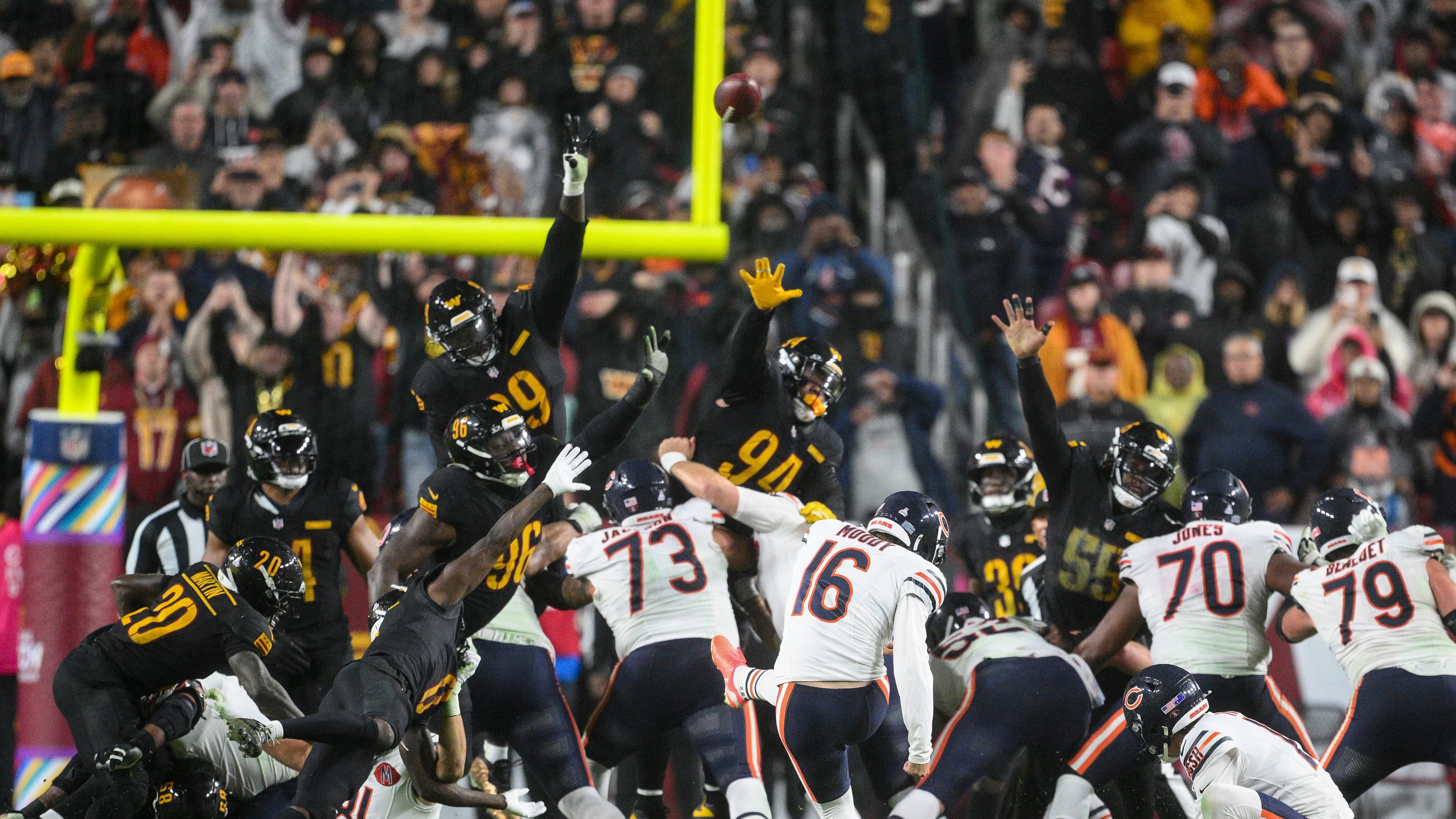 Chicago Bears kicker Jake Moody (16) kicks the game-winning field goal as time expires in an NFL football game against the Washington Commanders, Monday, Oct. 13, 2025, in Landover, Md. (AP Photo/Nick Wass)