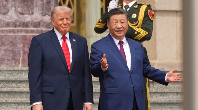 FILE - President Donald Trump, left, participates in a welcome ceremony with China's President Xi Jinping at the Great Hall of the People, May 14, 2026, in Beijing. (AP Photo/Mark Schiefelbein, File)