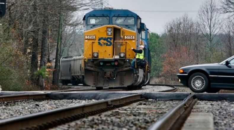 CSX train engineers arrive for work Friday morning. A freight train hit two teenagers near Kennesaw early Friday, March 12, 2010. The two young men were apparently lying near the tracks when they were hit around 1 a.m.