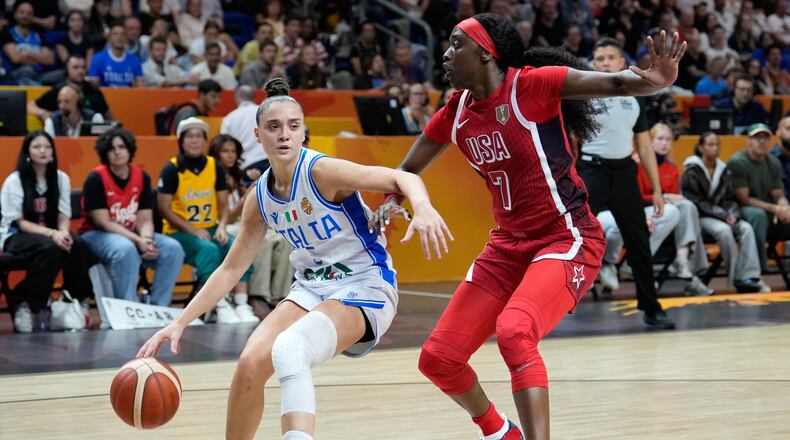 Kahleah Copper, of the United States, guards Italy's Matilde Villa during the Women's Basketball World Cup match between the United States and Italy in Berlin, Sunday, Sept. 6, 2026. (AP Photo/Ebrahim Noroozi)