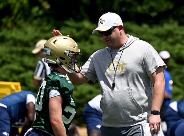 Georgia Tech's head coach Brent Key talks to Georgia Tech's quarter back Ben Guthrie (20) during a training camp at Georgia Tech’s Rose Bowl Field, Tuesday, August 1, 2023, in Atlanta. (Hyosub Shin / Hyosub.Shin@ajc.com)