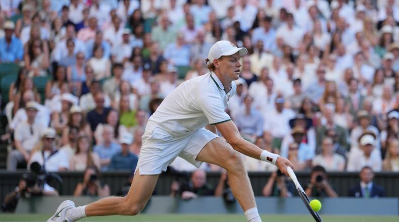 Jannik Sinner of Italy plays a return to Alexander Zverev of Germany during the men's singles final at Wimbledon Tennis Championships in London, Sunday, July 12, 2026. (AP Photo/Kin Cheung)