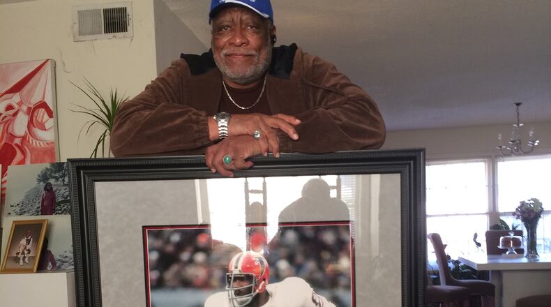 Claude Humphreyat his home this week (Jan. 2014) and portrait of himself w/ the Falcons. Steve Hummer / shummer@ajc.com