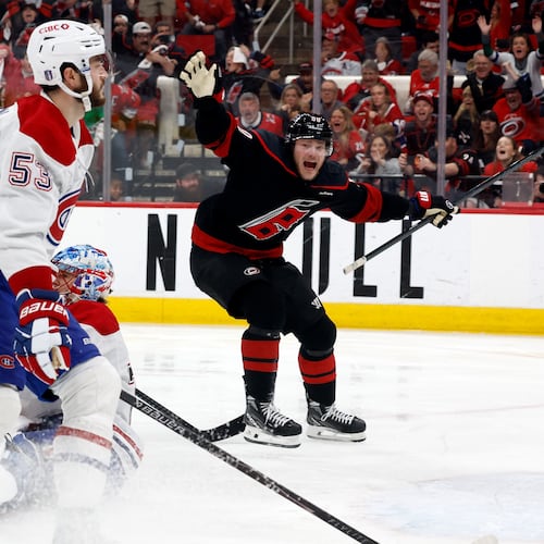 Carolina Hurricanes' Eric Robinson (50) reacts to the game wining overtime goal by Nikolaj Ehlers during overtime in Game 2 of the Eastern Conference final NHL hockey Stanley Cup playoff series in Raleigh, N.C., Saturday, May 23, 2026. (AP Photo/Karl DeBlaker)
