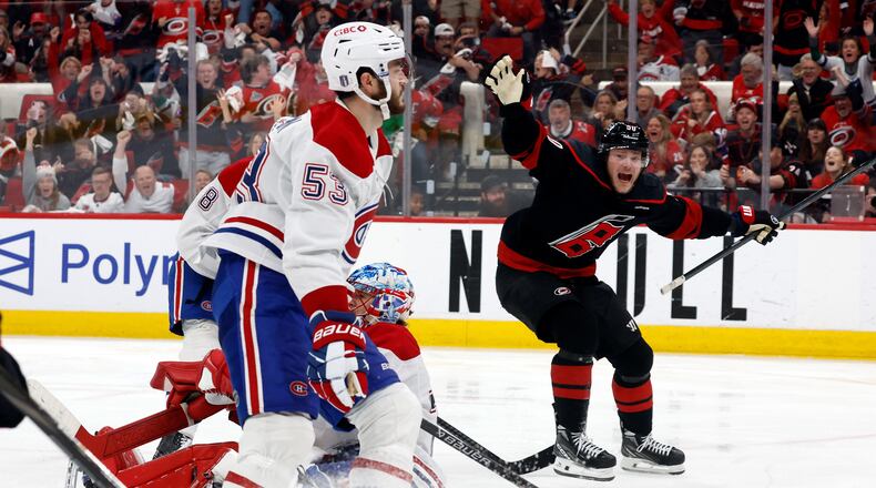 Carolina Hurricanes' Eric Robinson (50) reacts to the game wining overtime goal by Nikolaj Ehlers during overtime in Game 2 of the Eastern Conference final NHL hockey Stanley Cup playoff series in Raleigh, N.C., Saturday, May 23, 2026. (AP Photo/Karl DeBlaker)
