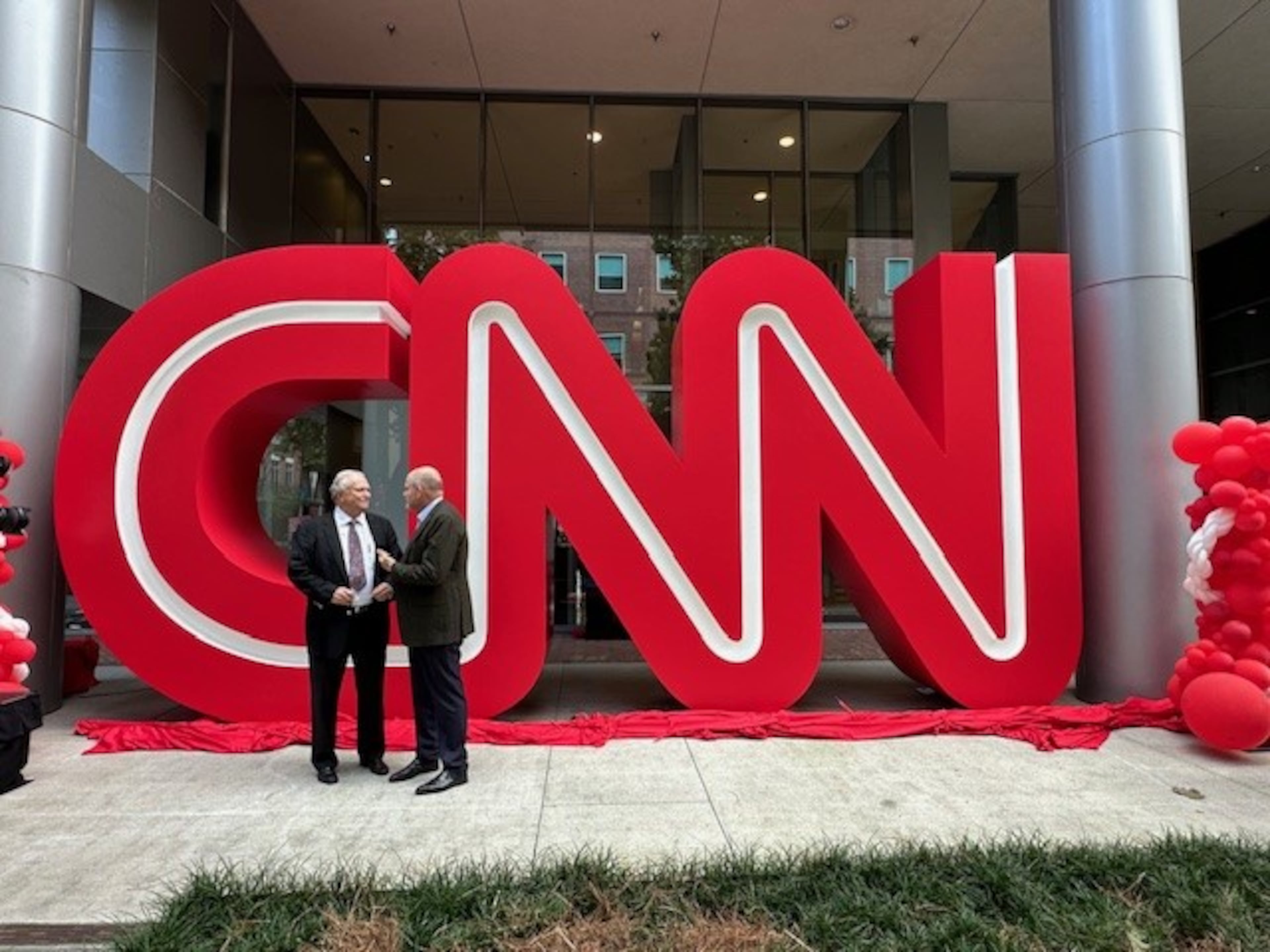 In 2024, CNN CEO Mark Thompson and former CNN president Tom Johnson meet at the Midtown Turner campus in Atlanta for the unveiling of the CNN logo previously at CNN Center. “Atlanta is both our literal and spiritual home,” Thompson said recently. (Courtesy photo)
