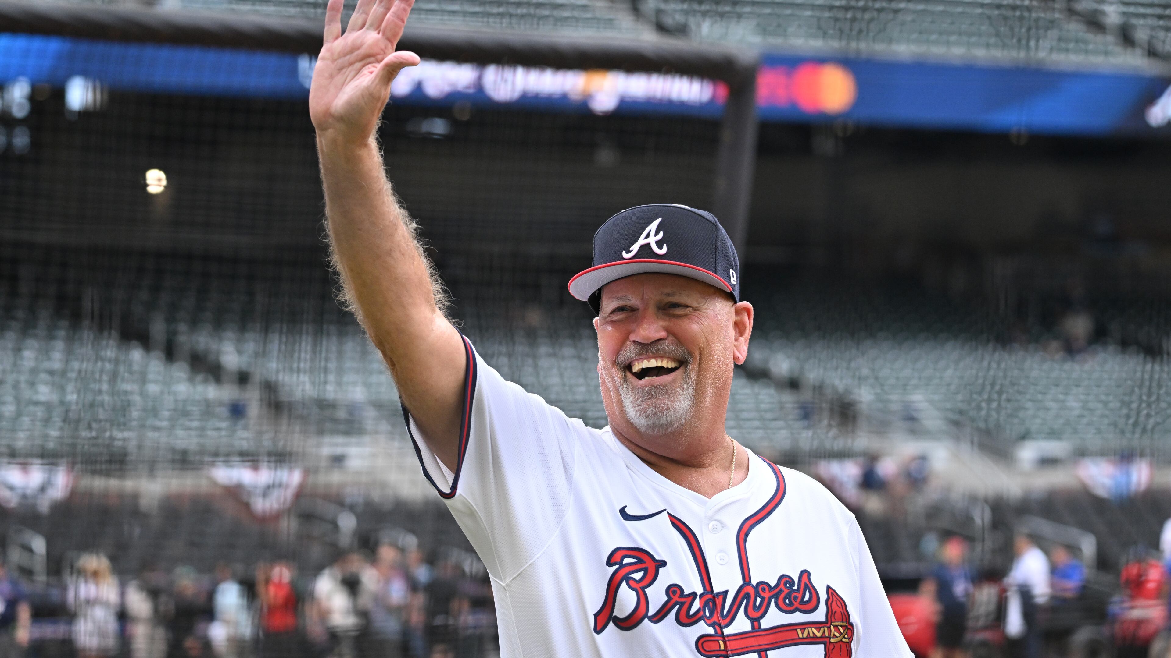 Atlanta Braves manager Brian Snitker waves as he walks on the baseball field before the 2025 MLB All-Star Game at Truist Park, Tuesday, July 15, 2025, in Atlanta. (Hyosub Shin/AJC)
