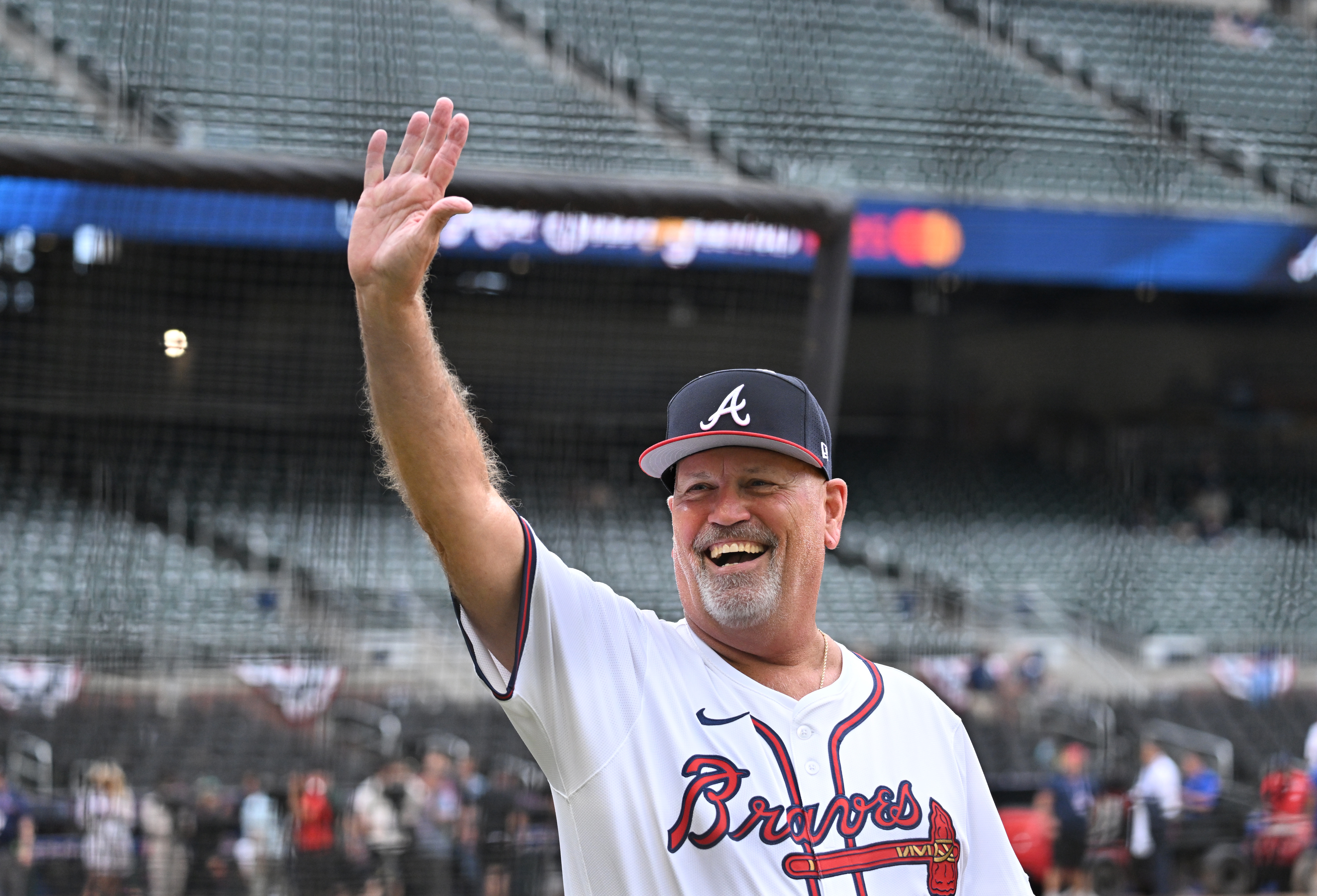 Atlanta Braves manager Brian Snitker waves as he walks on the baseball field before the 2025 MLB All-Star Game at Truist Park, Tuesday, July 15, 2025, in Atlanta. (Hyosub Shin/AJC)
