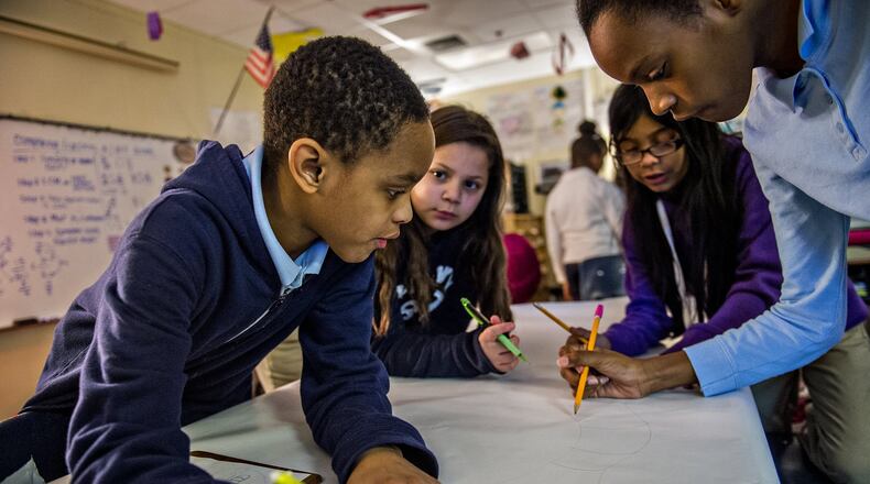 Antar Green (left), Brianna Espinoza, Kathleen Alfaro and Nia Murchison work together to draw a bug character during class at Powder Springs Elementary School. In recent years, school leaders used the acronym STEM (Science, Technology, Engineering & Math) to stress the importance of those subjects. Many now use STEAM to include the arts. Schools are integrating arts into how they teach other subjects. JONATHAN PHILLIPS / SPECIAL