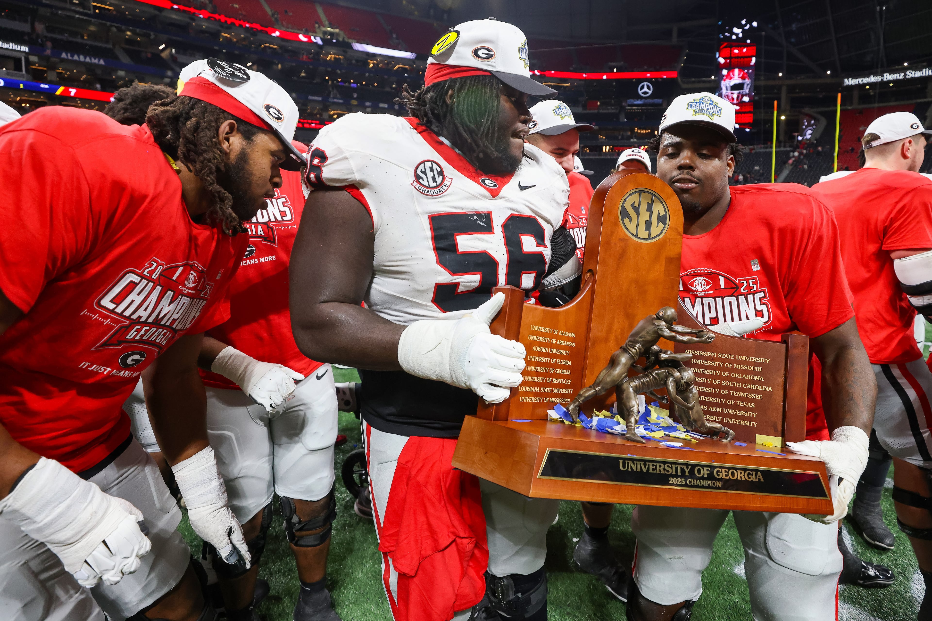 Georgia celebrates a 28-7 victory over Alabama in the SEC Championship game at Mercedes-Benz Stadium, Saturday, Dec. 6, 2025, in Atlanta. (Jason Getz / AJC)
