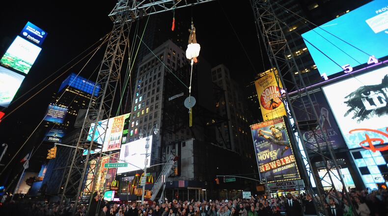 Magician Criss Angel performs his upside-down double straight jacket escape stunt in the middle of Times Square in 2009. It's the same stunt that landed him in the hospital on Friday