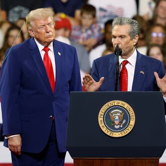 President Donald Trump looks on as Georgia Republican gubernatorial candidate Rick Jackson speaks during a rally at Wheeler High School in Marietta, Ga., Wednesday, July 22, 2026. (Erik S. Lesser/AP)