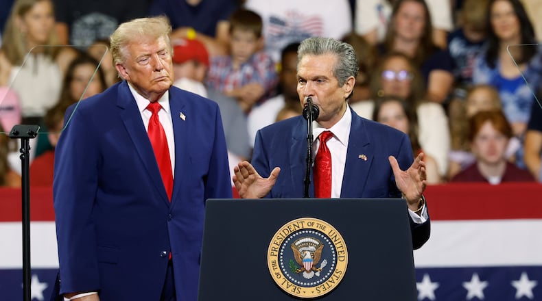 President Donald Trump looks on as Georgia Republican gubernatorial candidate Rick Jackson speaks during a rally at Wheeler High School in Marietta, Ga., Wednesday, July 22, 2026. (Erik S. Lesser/AP)